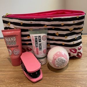 Make up bag with hand lotion, face wash, brush, and bath bomb. New with tags